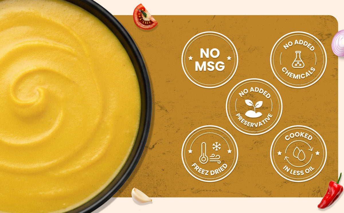 Yellow smoothie bowl with health benefits label on a brown background