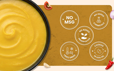 Yellow smoothie bowl with health benefits label on a brown background