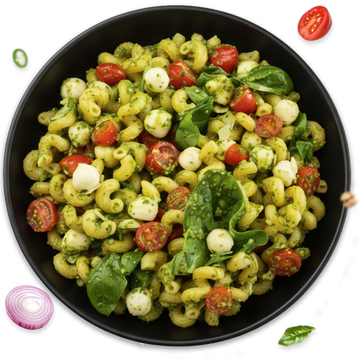 Pasta salad with green pesto, cherry tomatoes, and mozzarella pearls in a black bowl.