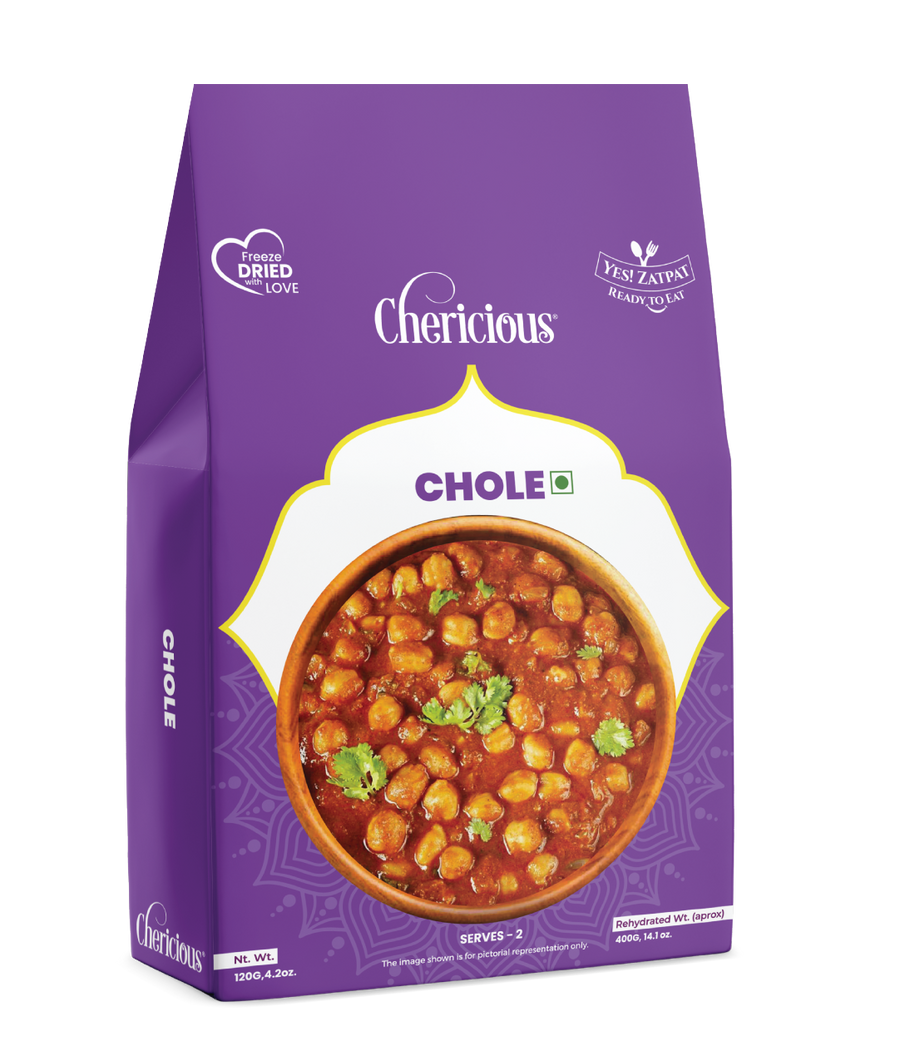 Purple package of Chericious Chole with a bowl of chickpea curry on a white background